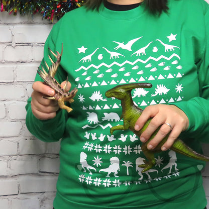 Green sweater with white dinosaur design ideal for the festive and christmas season