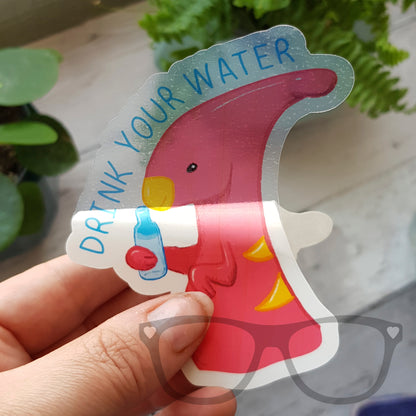 Irene the Dinosaur vinyl sticker with the message 'Drink Your Water' in vibrant colours, perfect for decorating water bottles, notebooks, and laptops