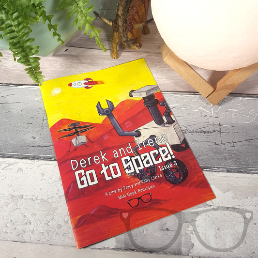 Cover of Issue 3 Derek and Irene Zine featuring a space adventure theme with Derek and Irene in a rocket