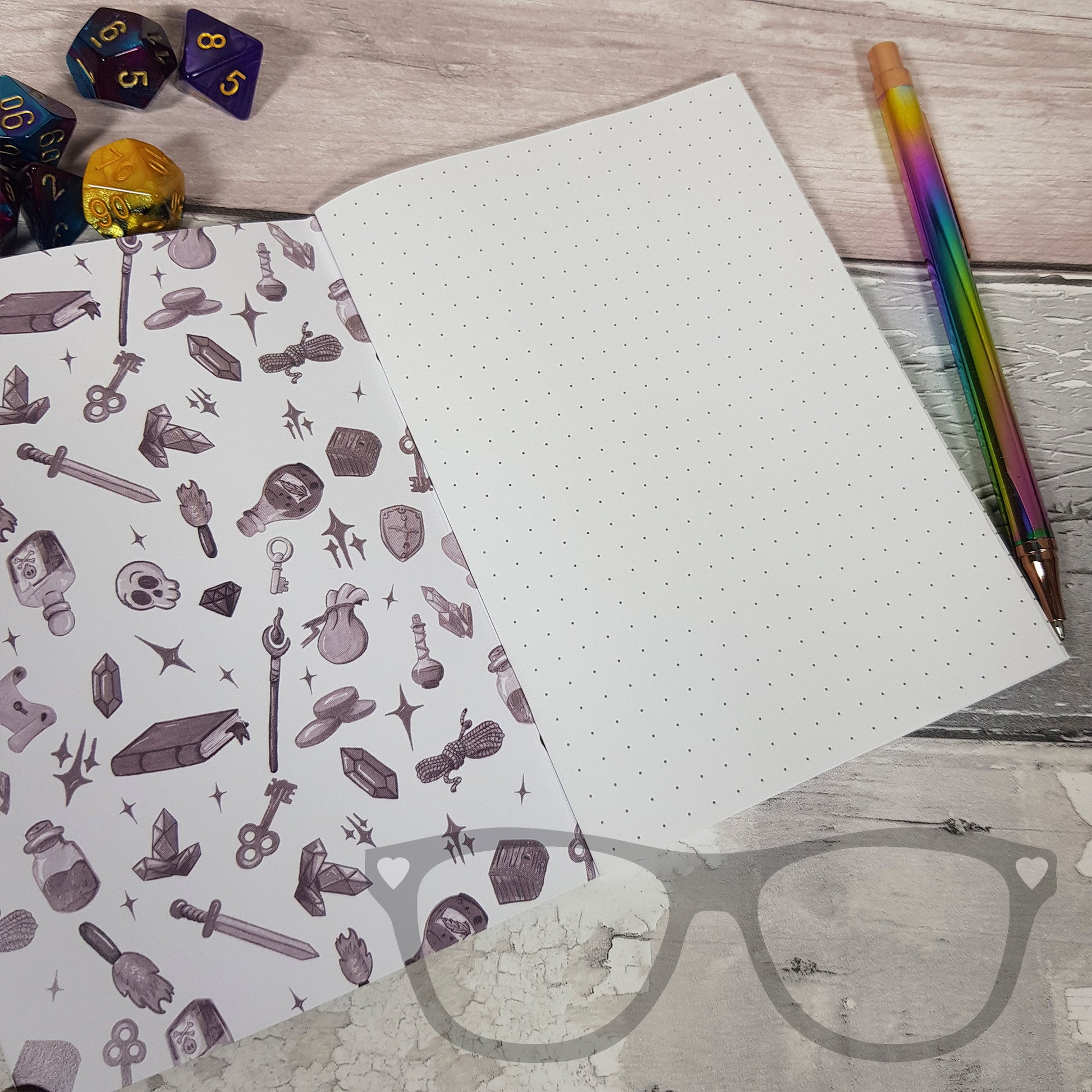 A6 fantasy notebook showing inside dotted grid pages