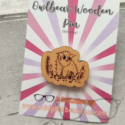 Owlbear pin on backing card