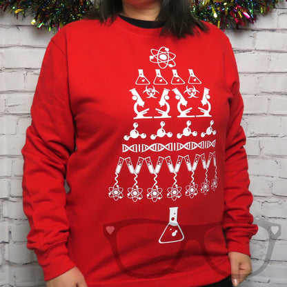 White science design in the shape of a Christmas tree, on a fire red sweater