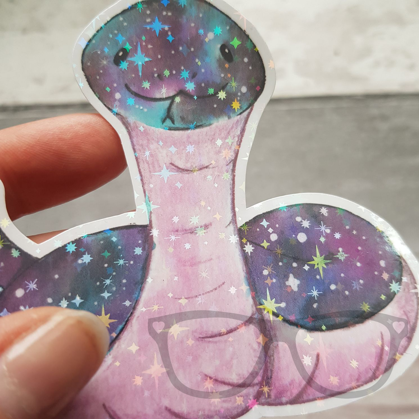 Snake vinyl sticker with star sparkles overlay close up