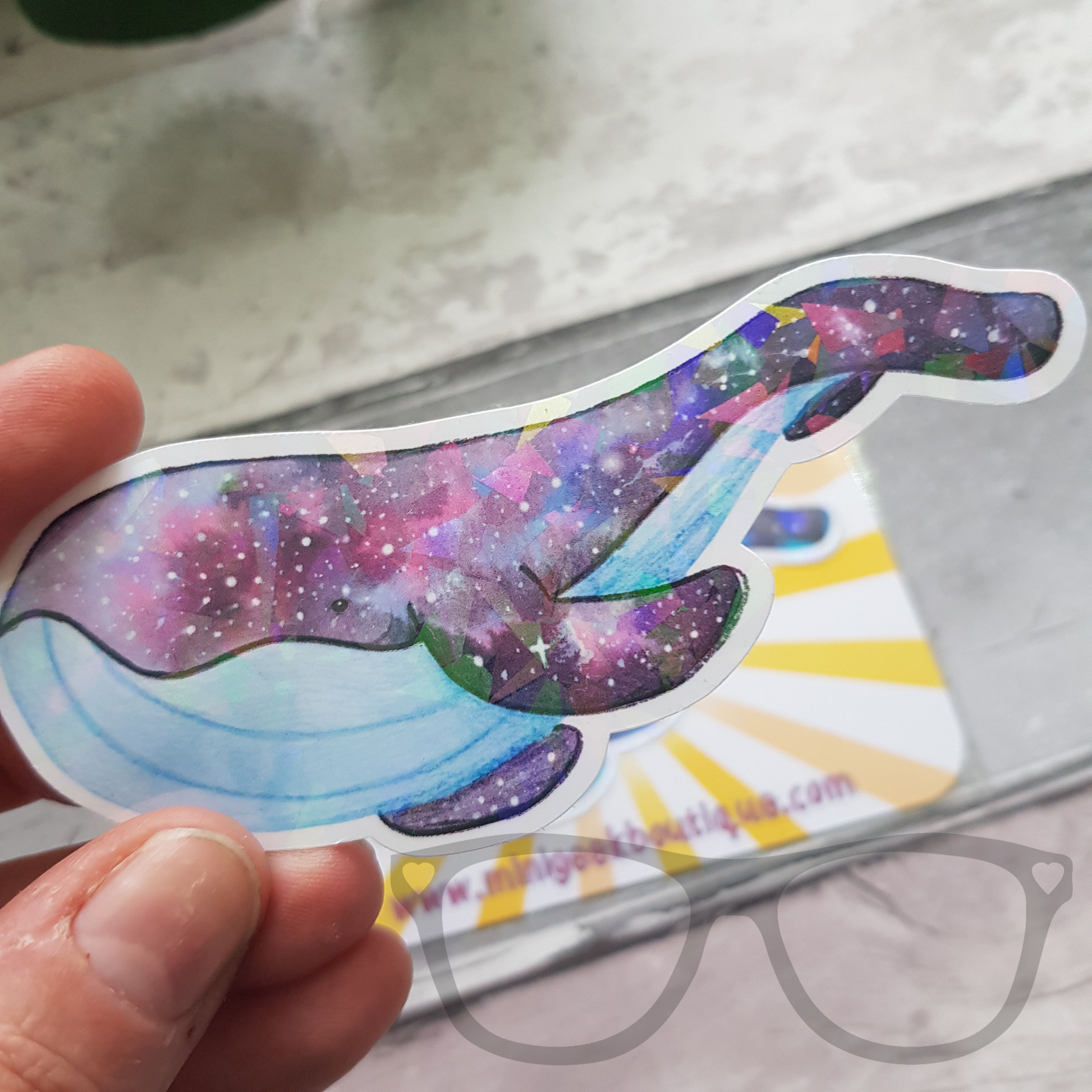 Sparkly space whale vinyl sticker great for decorating bottles, and notebooks.