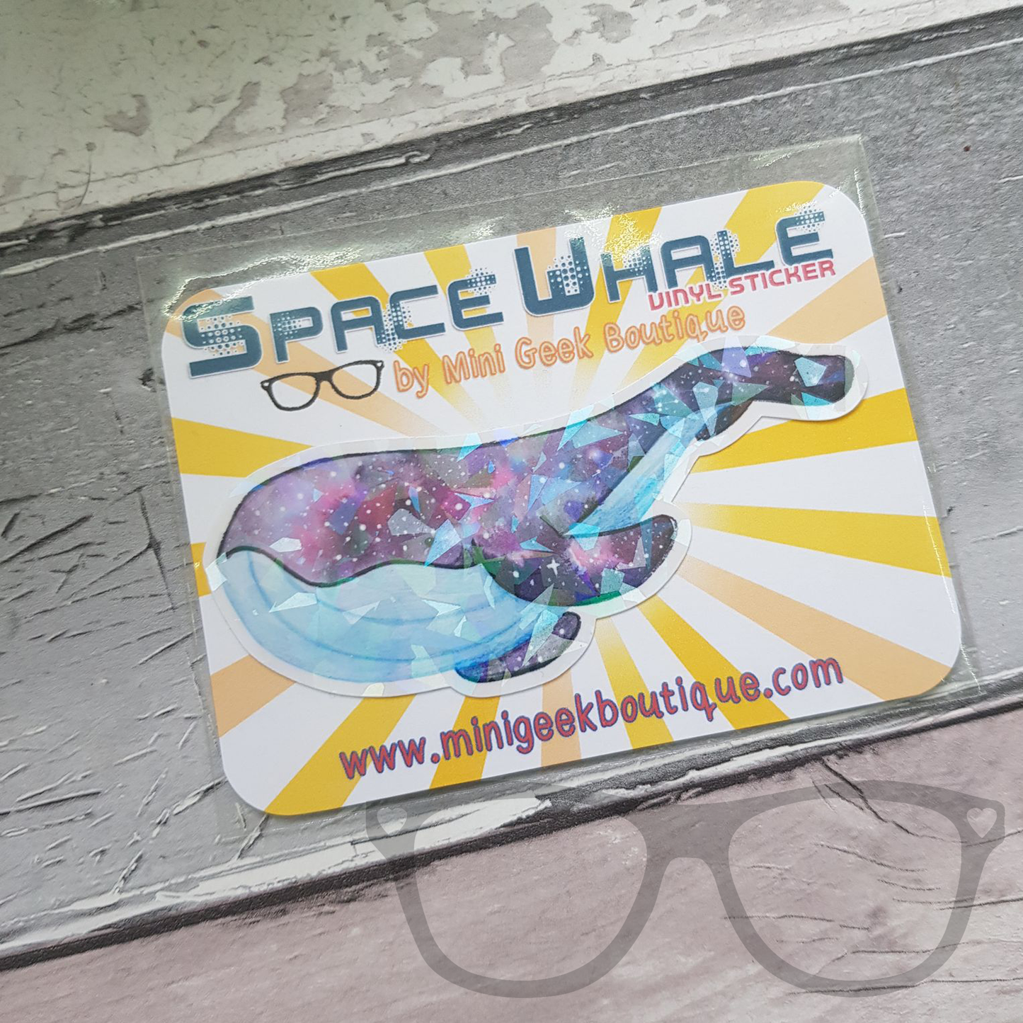 Sparkly space whale vinyl sticker in eco friendly packaging