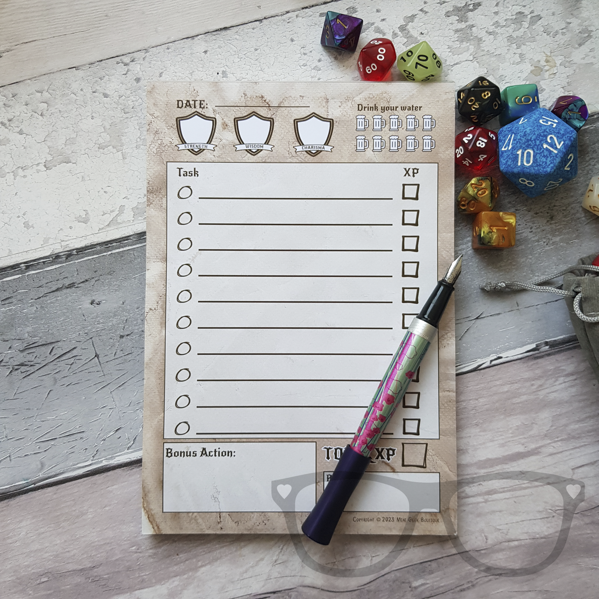 A5 To do list with drinks tracker shown pen and dice